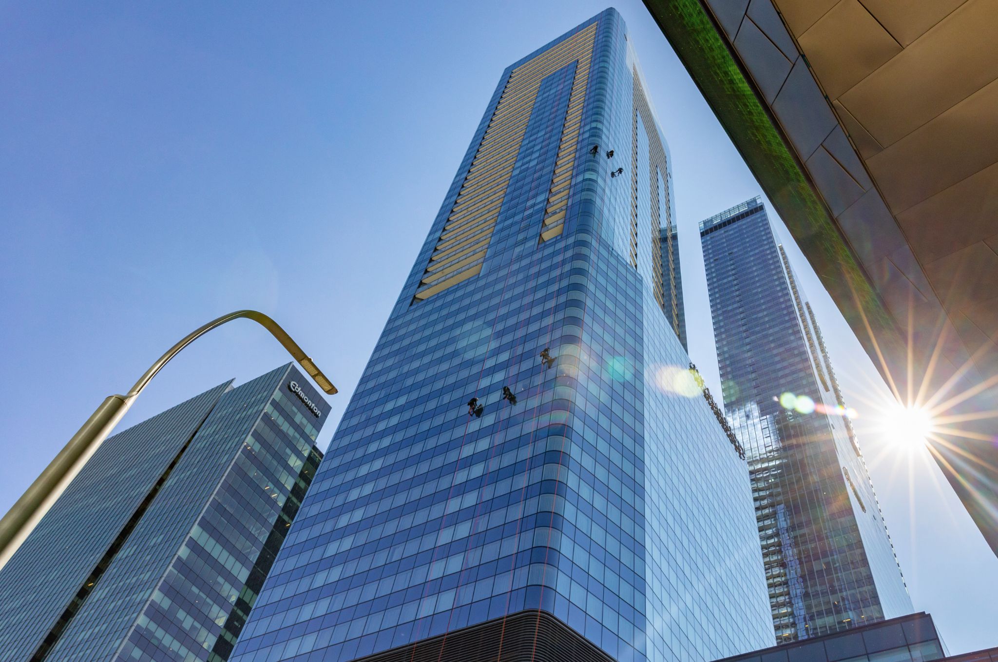 aurora rope access high-rise crew working on the JW marriott edmonton ice district building