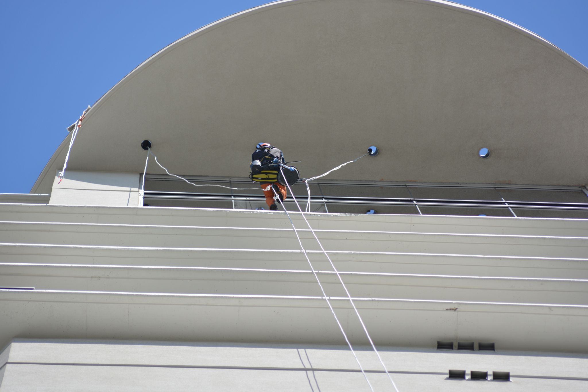 aurora industries team in edmonton downtown apartment building with rope access
